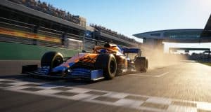 Victoire de Lando Norris en Hongrie 2026 : le succès McLaren Une monoplace McLaren orange et bleue franchit la ligne d'arrivée sur le circuit de Hongrie sous un soleil éclatant.